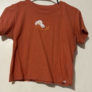 ONEILL- Cropped orange tee shirt with flower logo